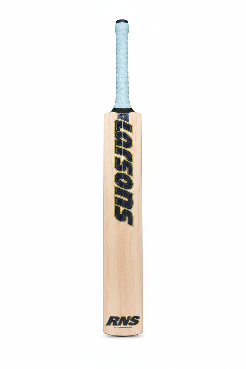 A wooden cricket bat with 'LUSONS' and 'RNS' branding, laid flat on green grass.